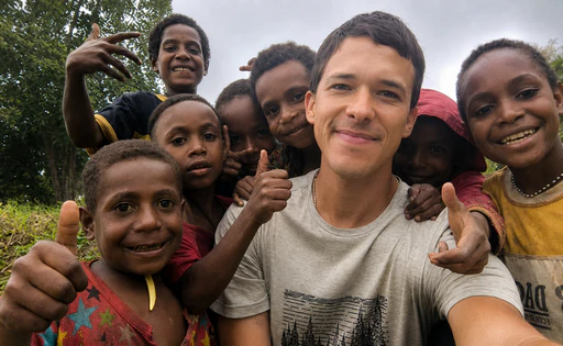 Mikhail Golodok bringing humanitarian aid to people in mountain villages in Papua